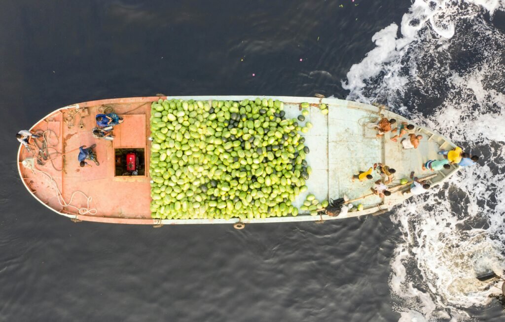 High-angle view of a boat transporting watermelons on the sea.